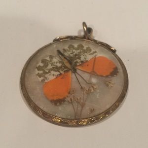 Vintage 14 kt butterfly encased in glass